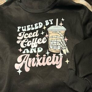 Graphic crew neck sweatshirt “fueled by iced coffee and anxiety”